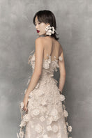 Elegant floral lace gown with metal beads by Phan Huy, featuring intricate lace details and a graceful silhouette.