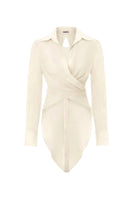White Ulysse shirt by IKINITA, featuring a classic button-up design with a collar and long sleeves, displayed on a model.