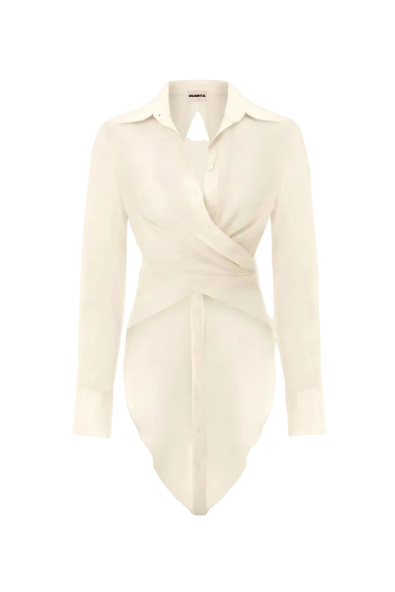 White Ulysse shirt by IKINITA, featuring a classic button-up design with a collar and long sleeves, displayed on a model.