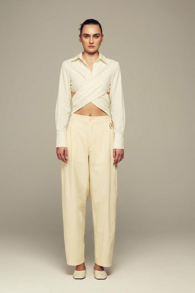 White Ulysse shirt by IKINITA, shown laid flat with long sleeves and classic collar, highlighting the clean, minimalist design.