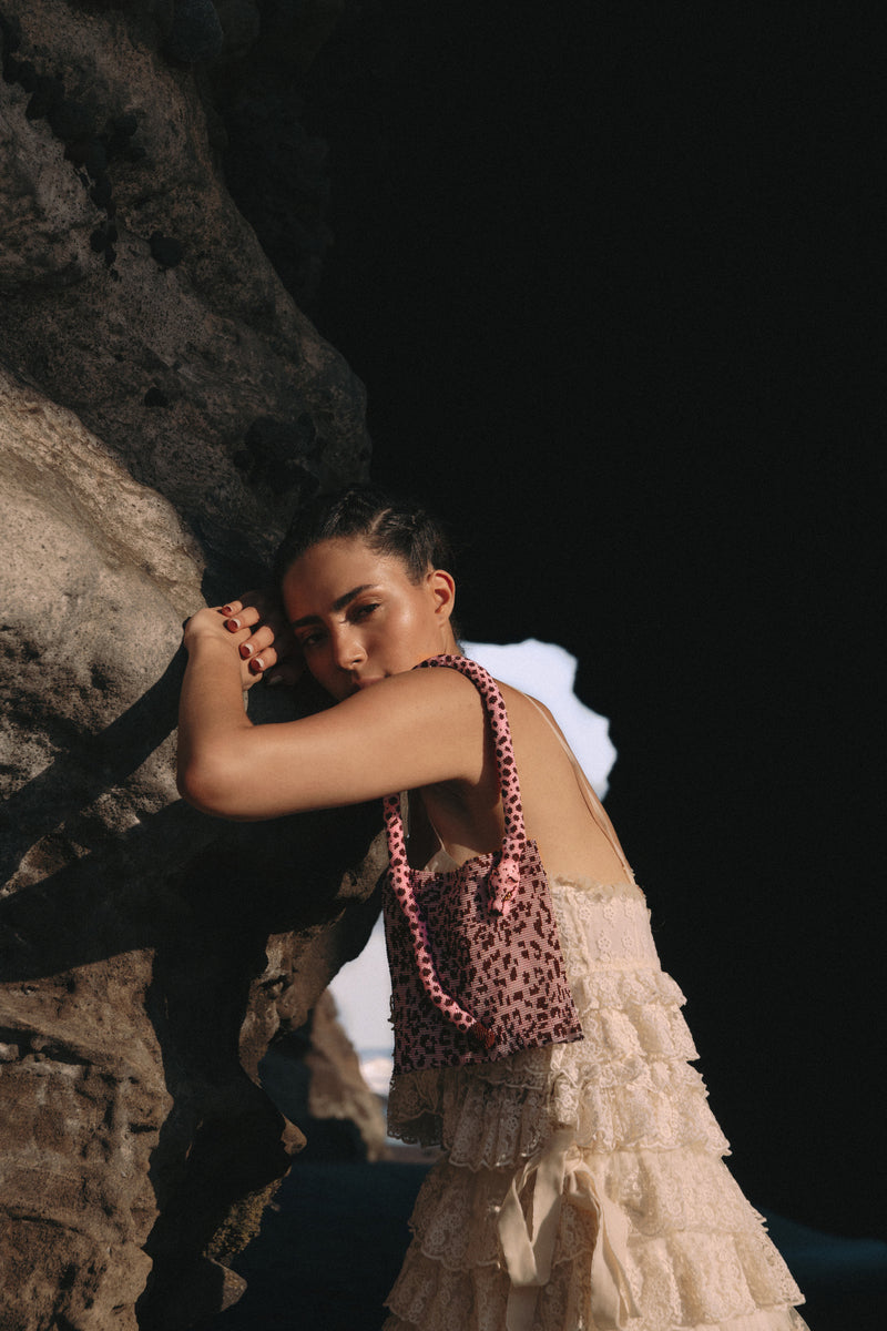 Pink Panther Serpent shoulder bag by Sac de Soul featuring a sleek design and textured serpent pattern.