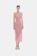 Pink beaded lace pencil gown by Montsand, close-up of elegant lace fabric with intricate bead detailing.