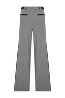 Light beige Tagg pleated wide-leg pants featuring a high waist and flowing fabric, displayed on a neutral background.