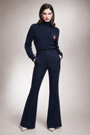 Liya Soft Line Pants in neutral fabric with a relaxed fit, featuring waistband and side pockets for comfortable everyday wear.