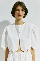 White crop top from PODYH's DZVINYTSYA collection, featuring a stylish, fitted design perfect for casual or trendy outfits.