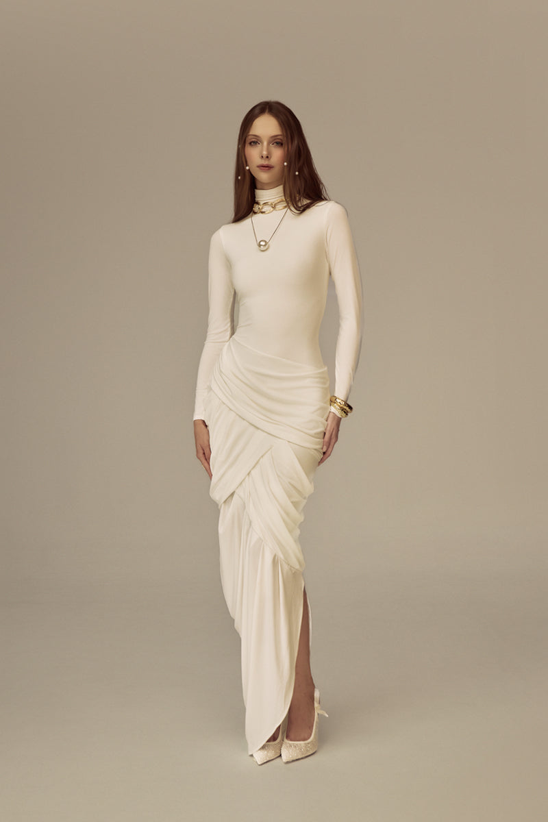White POEM Thalora midi dress displayed on a hanger, showcasing its elegant design and flowy fabric.
