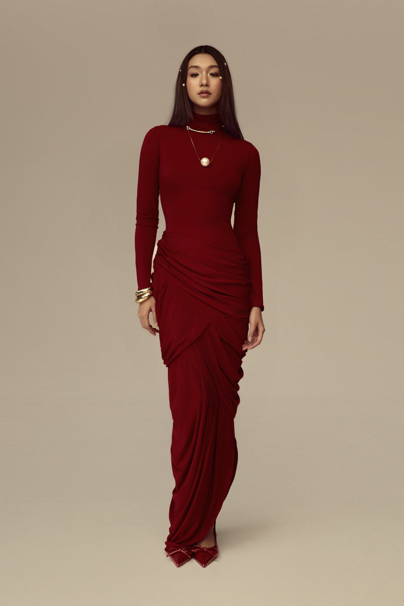 Red POEM Thalora midi gown with elegant flowy fabric and fitted waist, perfect for formal occasions.