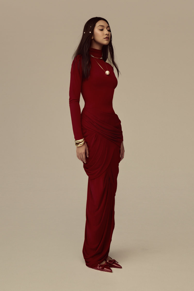 Red Thalora midi gown by POEM, featuring elegant fabric and a flowing silhouette, perfect for formal occasions.