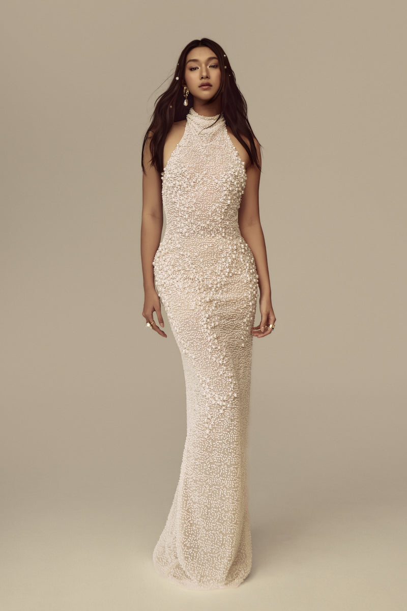 Elegant POEM Pearlescence gown featuring a flowing design with pearlescent fabric and intricate detailing.