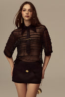POEM Marabel mini skirt in black, stylish high-waisted design, with a fitted silhouette and subtle stitching details.