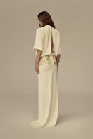 Poem Radiara maxi dress featuring a flowing silhouette and floral pattern, perfect for elegant summer occasions.
