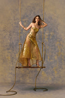 Elegant AURIELLE gown by POEM, featuring flowing fabric and intricate details, displayed on a mannequin.