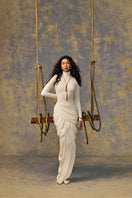 White POEM Thalora midi dress displayed on a model, featuring a flowy fabric and elegant length suitable for casual or formal wear.