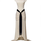 Elegant ivory Primrose dress by Jenny K Tran, showcasing its flowing gown design with delicate fabric details.