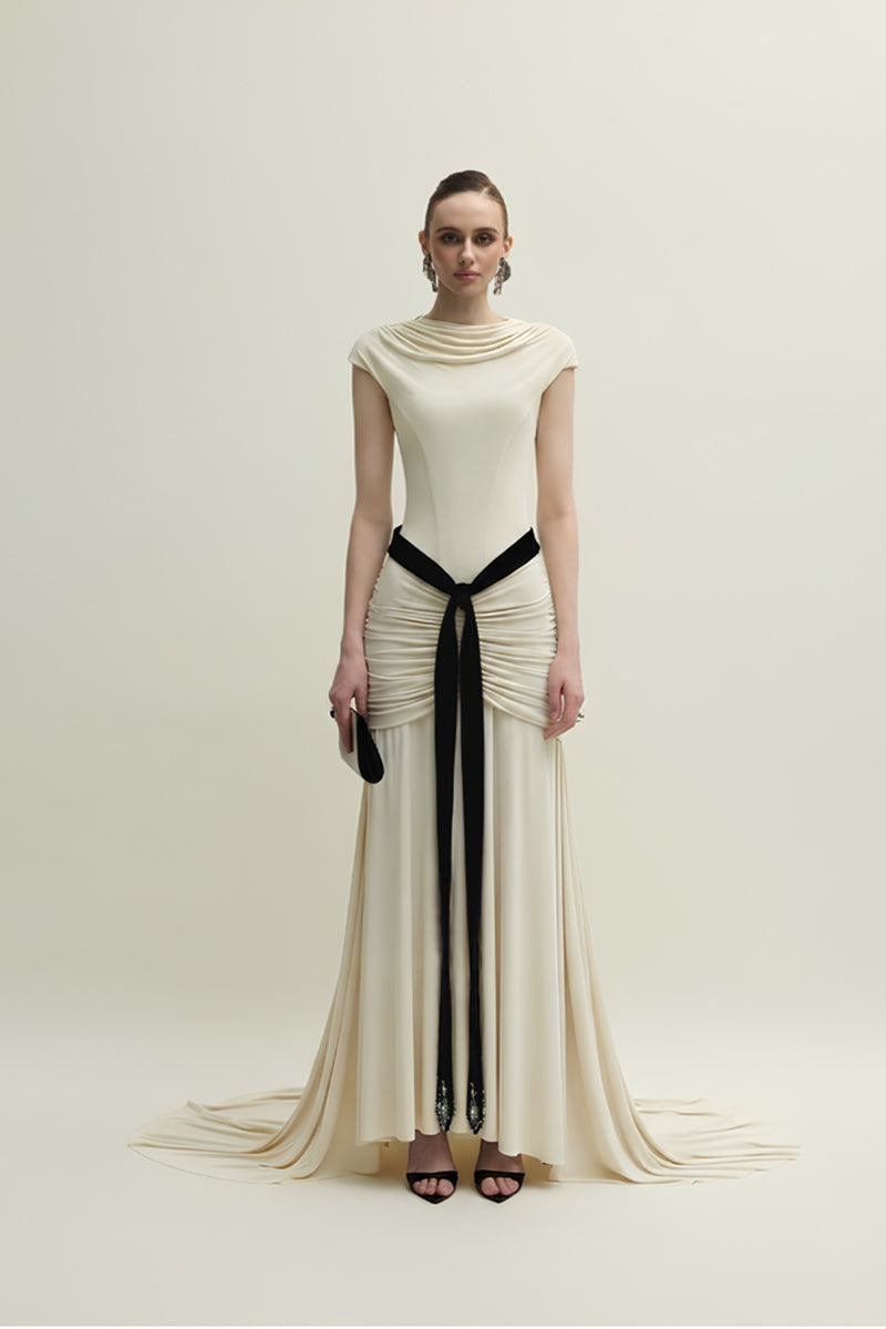 Elegant ivory Primrose gown by Jenny K Tran featuring flowy fabric and intricate detailing, perfect for formal occasions.