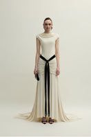 Elegant ivory Primrose gown by Jenny K Tran featuring flowy fabric and intricate detailing, perfect for formal occasions.
