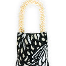 SAC DE SOUL Clash of Prints Butterfly shoulder bag in black, cream, and white with a bold floral pattern.