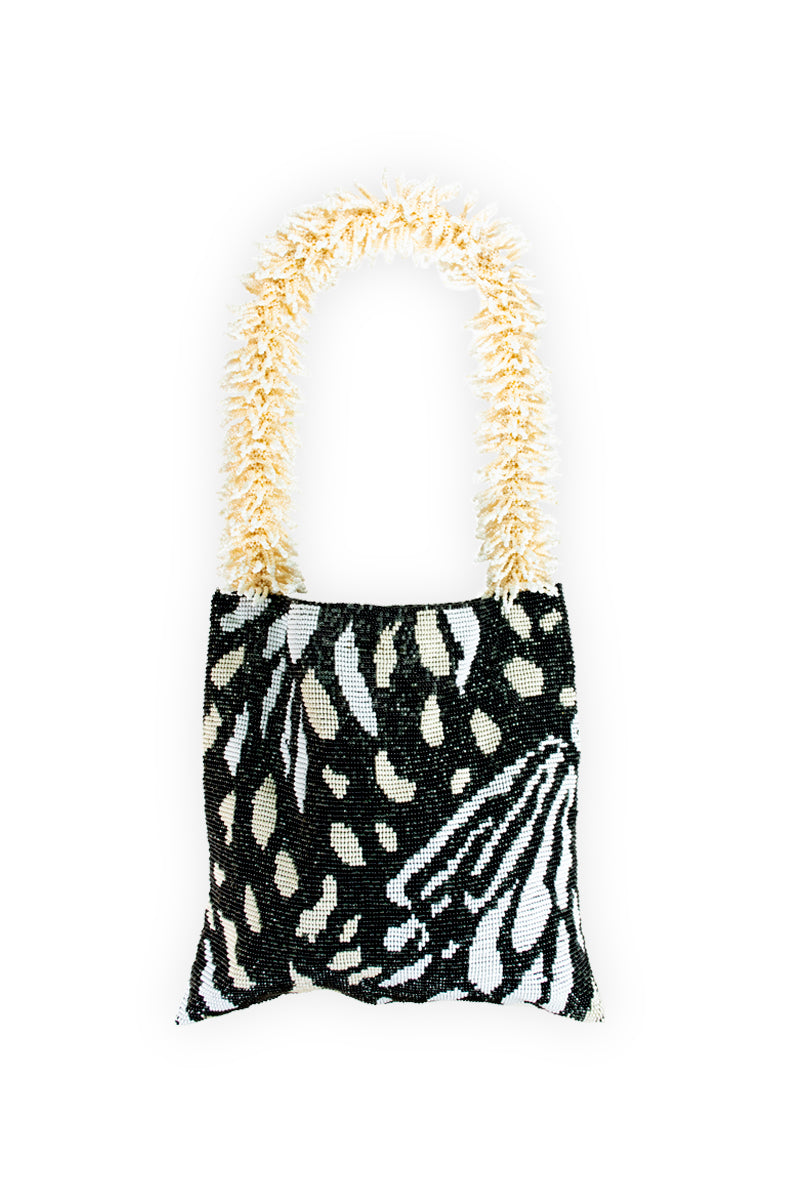 SAC DE SOUL Clash of Prints Butterfly shoulder bag in black, cream, and white with a bold floral pattern.