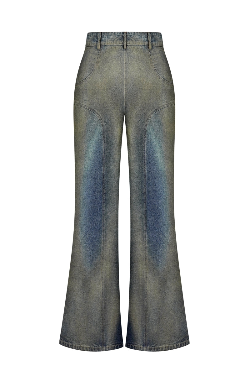 Back view of NADYA DZYAK flared jeans in rusty denim with a high waist and wide leg silhouette.