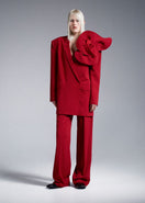 Red straight high-rise pants by Nadya Dzyak, featuring a sleek fit and tailored design, shown on a model.