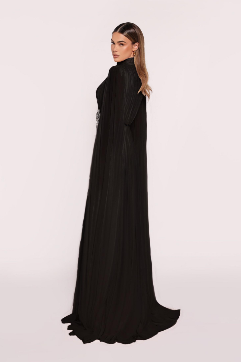 Black Punch Dress gown by Tarık Ediz, featuring elegant design and fitted silhouette, displayed on a mannequin.