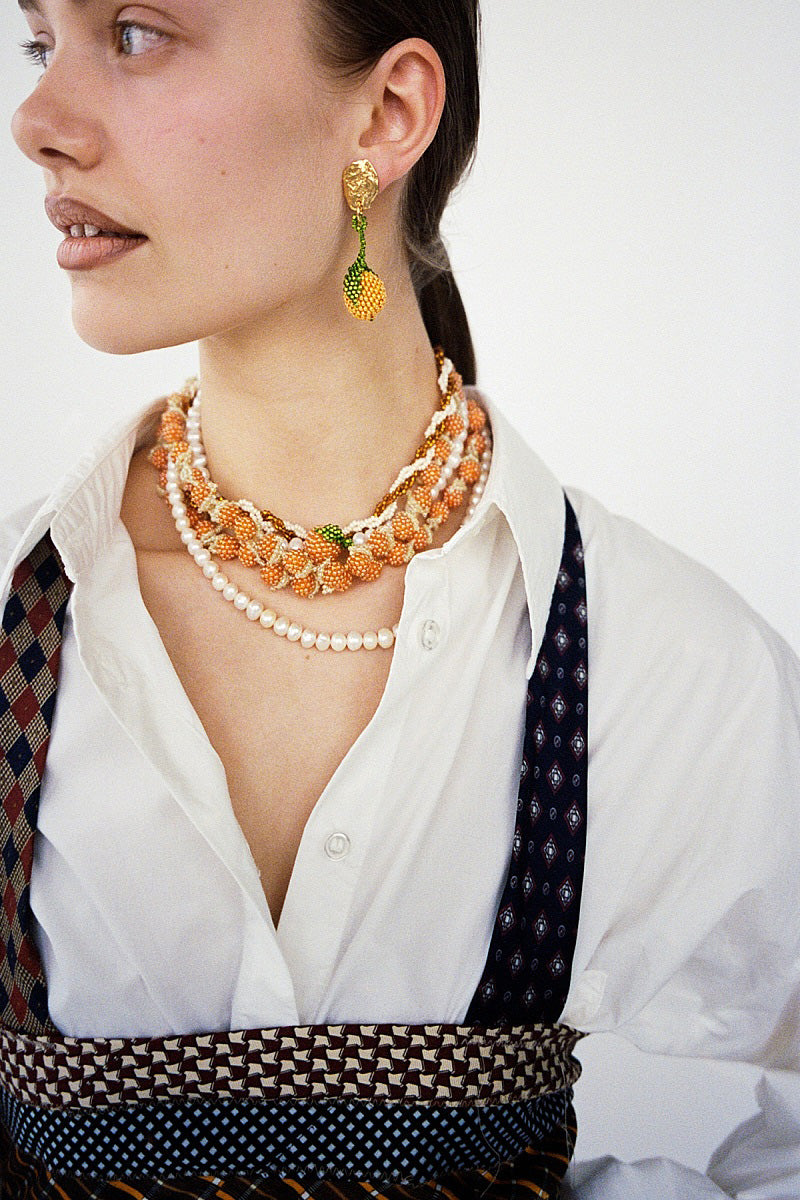 Orange Galore Necklace by Pura Utz featuring vibrant orange beads and stylish design for a bold accessory.
