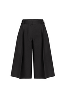 Serenity Paige black silk and wool blend shorts displayed on a hanger, showcasing the stylish and elegant design.
