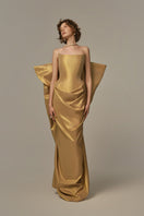 Poem Palais gown in golden fleece fabric, elegant long evening gown with intricate design and flowing silhouette.
