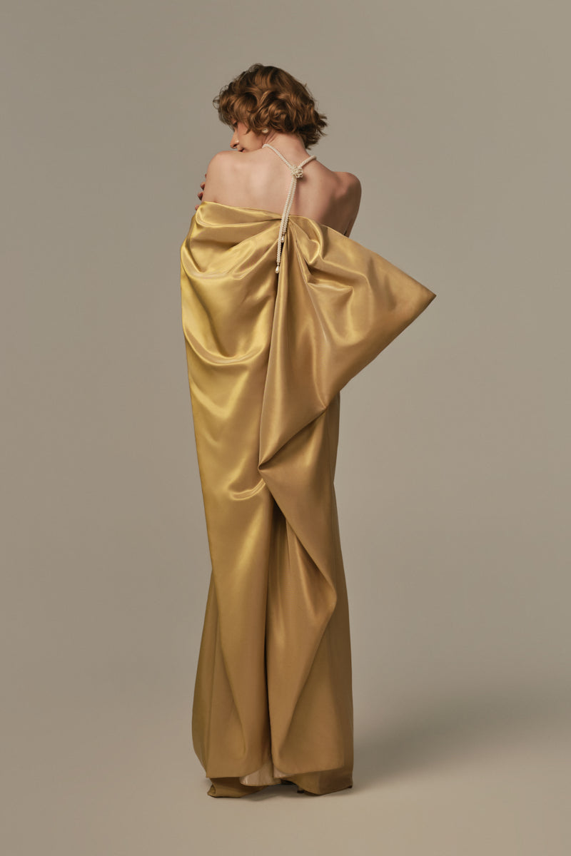 Elegant Palais Gown by POEM featuring a flowing design in a rich golden hue, perfect for formal occasions.