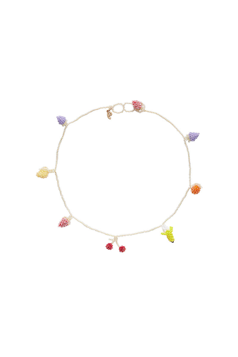 Pura Utz Pale Fruit Salad Necklace featuring colorful, handcrafted fruit-shaped beads on a delicate chain.