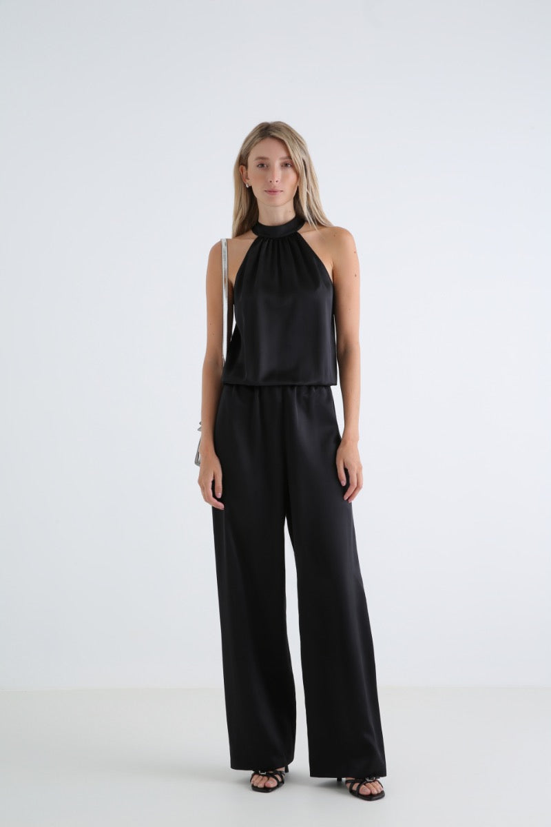 Serenity Palermo black silk-satin halter jumpsuit featuring a fitted bodice and wide-leg pants, stylish and elegant for evening wear.