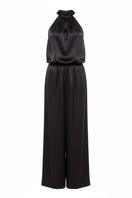 Serenity Palermo black silk-satin halter jumpsuit displayed on a hanger, showcasing its sleek design and elegant fabric.