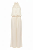 Serenity Palermo butter-cream silk-satin halter jumpsuit displayed on a hanger with elegant drape and smooth fabric.