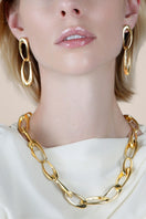 Sara Shala Palermo earrings in yellow gold vermeil displayed on a model, showcasing elegant, handcrafted jewelry.