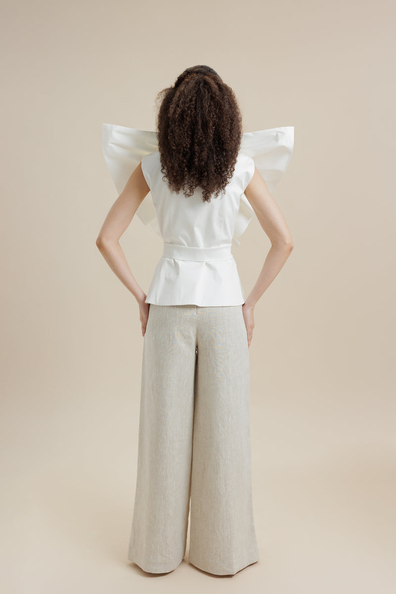 Ivory Palma blouse by ANA + MARIA, a stylish women's top with long sleeves and elegant design, shown on a model.