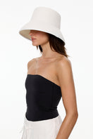 LE SH KA Panama White hat with a classic straw design, featuring a wide brim and stylish band for a fashionable summer look.