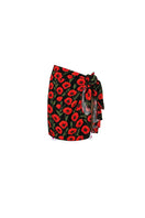 Black Poppy pareo mini cover-up by Verdelimon, shown front view, lightweight fabric with floral pattern perfect for beachwear.