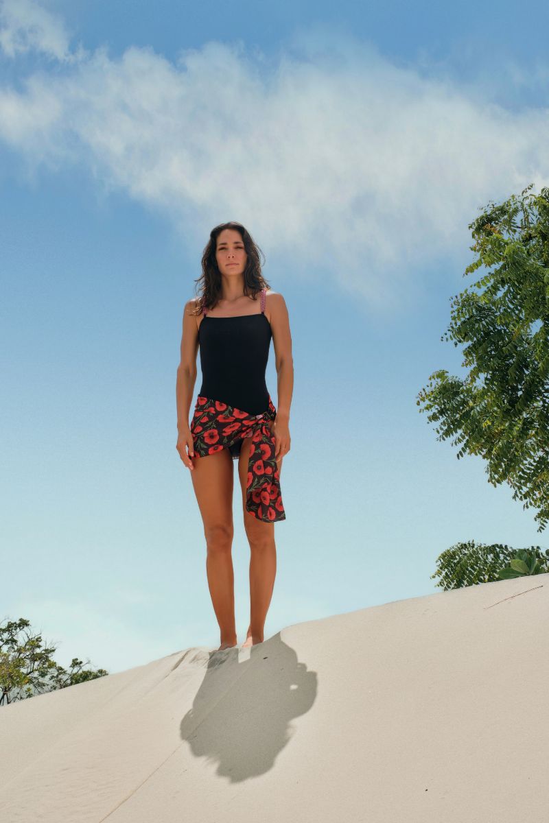 Verdelimon PAREO MINI IN BLACK POPPY cover-up featuring a lightweight, stylish fabric with a black poppy print.