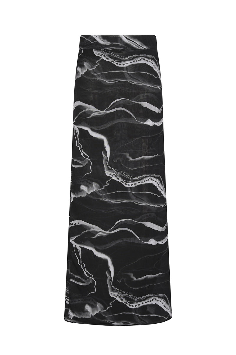 Nelblu black printed pareo skirt, a lightweight cover-up with vibrant tropical print, perfect for beachwear or poolside style.