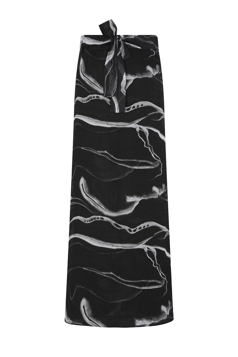 Nelblu black print pareo skirt, a stylish cover-up with vibrant print, perfect for beachwear or poolside lounging.