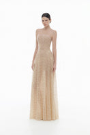 Pastel crystal beaded maxi gown by Montsand featuring intricate beadwork and flowing fabric in soft pastel shades.