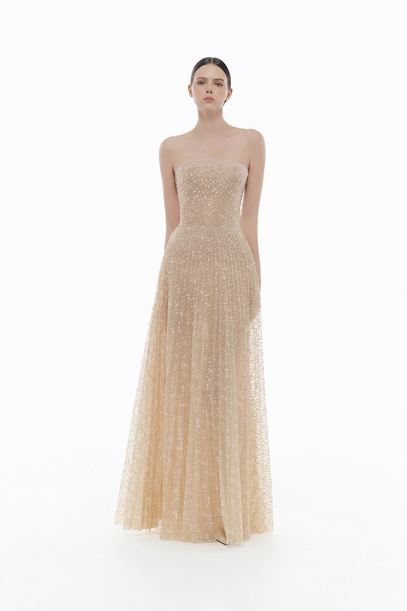 Elegant pastel crystal beaded maxi gown by Montsand featuring intricate beadwork and flowing fabric for formal occasions.
