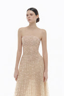 Elegant pastel crystal beaded maxi gown by Montsand, featuring intricate beadwork and flowing fabric for formal occasions.
