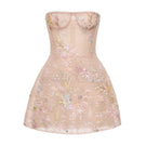 Pastel flower embellished mini dress by Montsand, featuring a delicate floral design and feminine style for summer occasions.