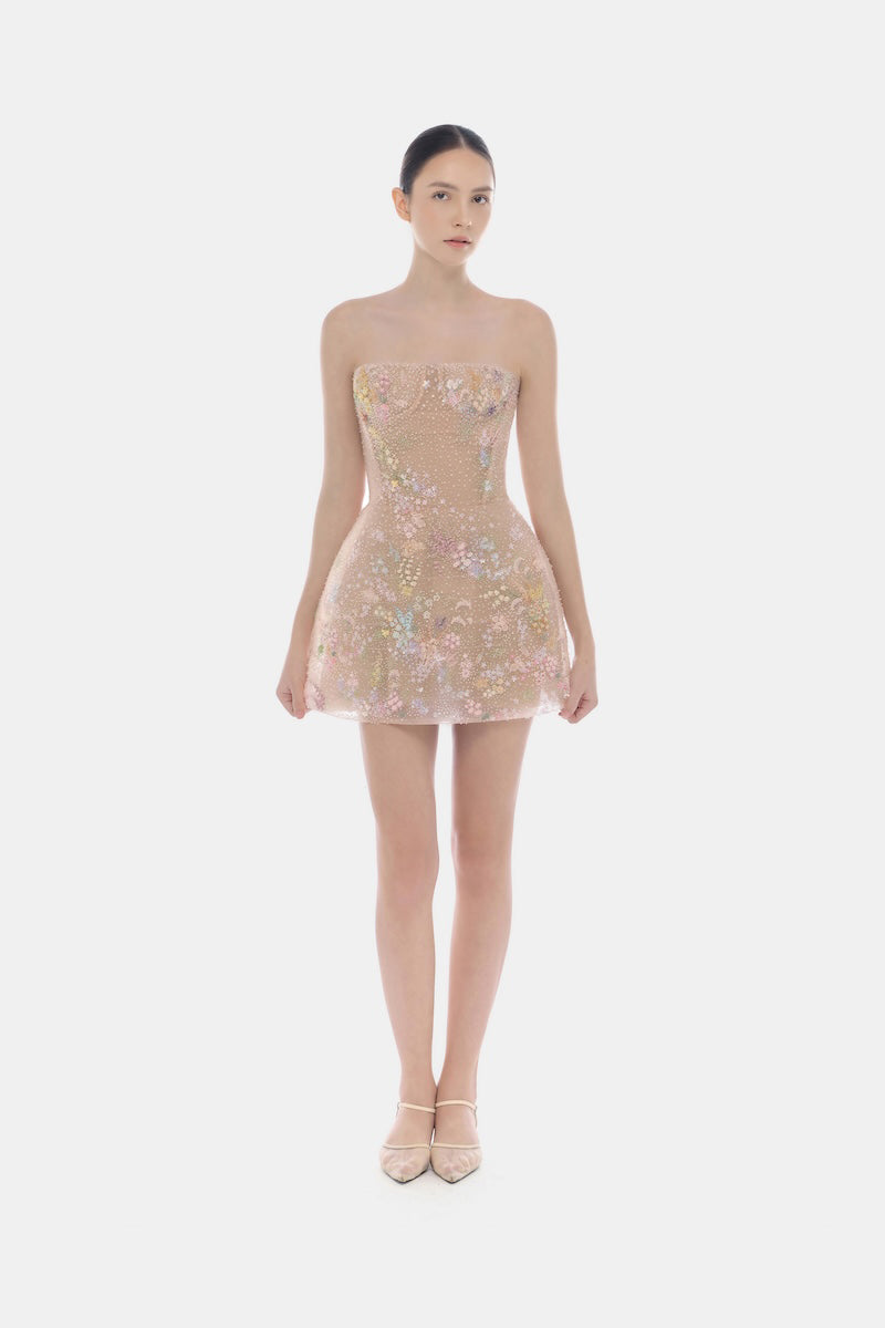 Pastel flower-embellished mini dress by Montsand, featuring a feminine design with floral details and a fitted silhouette.