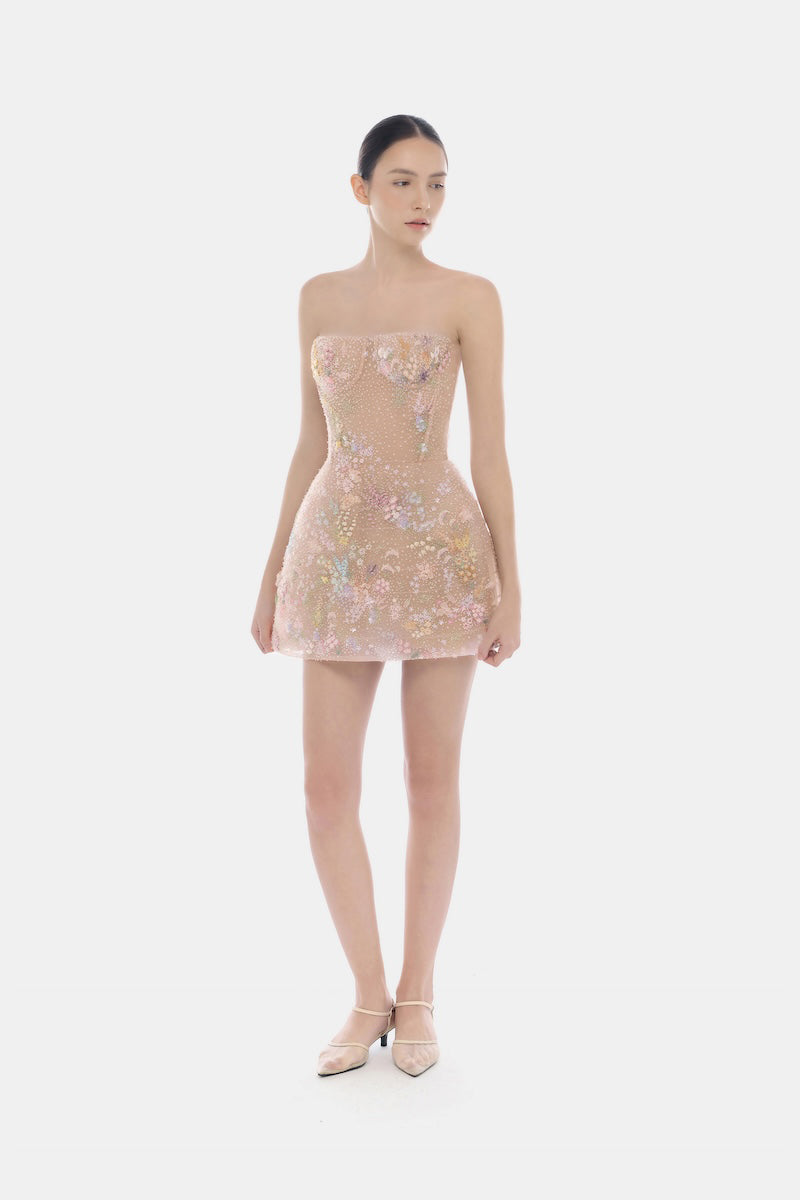 Pink pastel mini dress by Montsand with floral embellishments and delicate detailing, perfect for spring or summer occasions.
