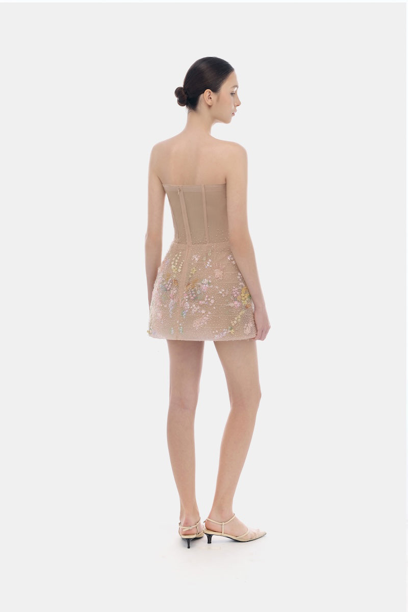 Montsand pastel mini dress with floral embellishments, featuring a fitted silhouette and delicate design details.