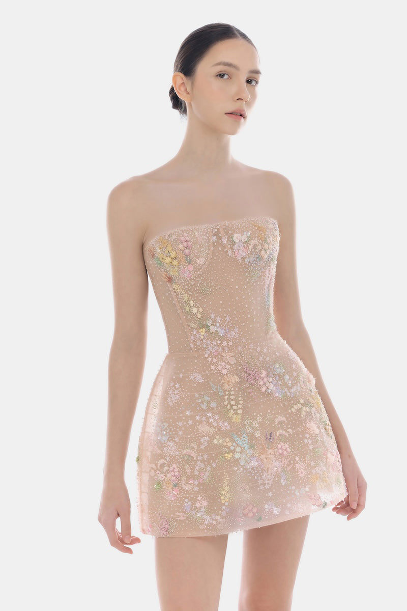 Pastel-colored mini dress with floral embellishments by Montsand, featuring a fitted silhouette and delicate flower details.