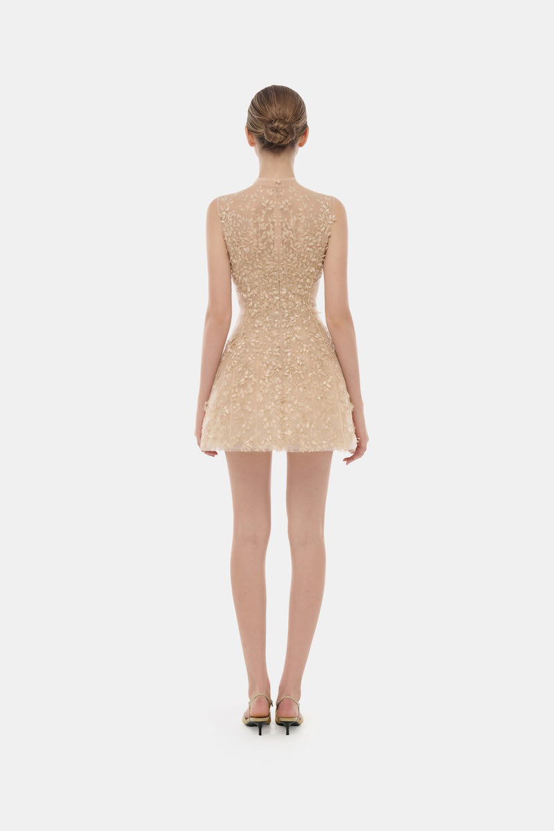 Light pastel sleeveless mini dress with mock neck from Montsand, featuring a fitted silhouette and smooth fabric.