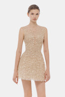 Light pink sleeveless mini dress with a mock neck from Montsand, featuring a fitted silhouette and smooth fabric.